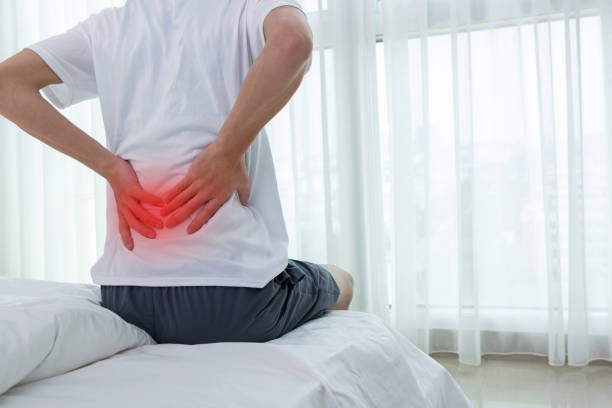 Young man with lower back pain.